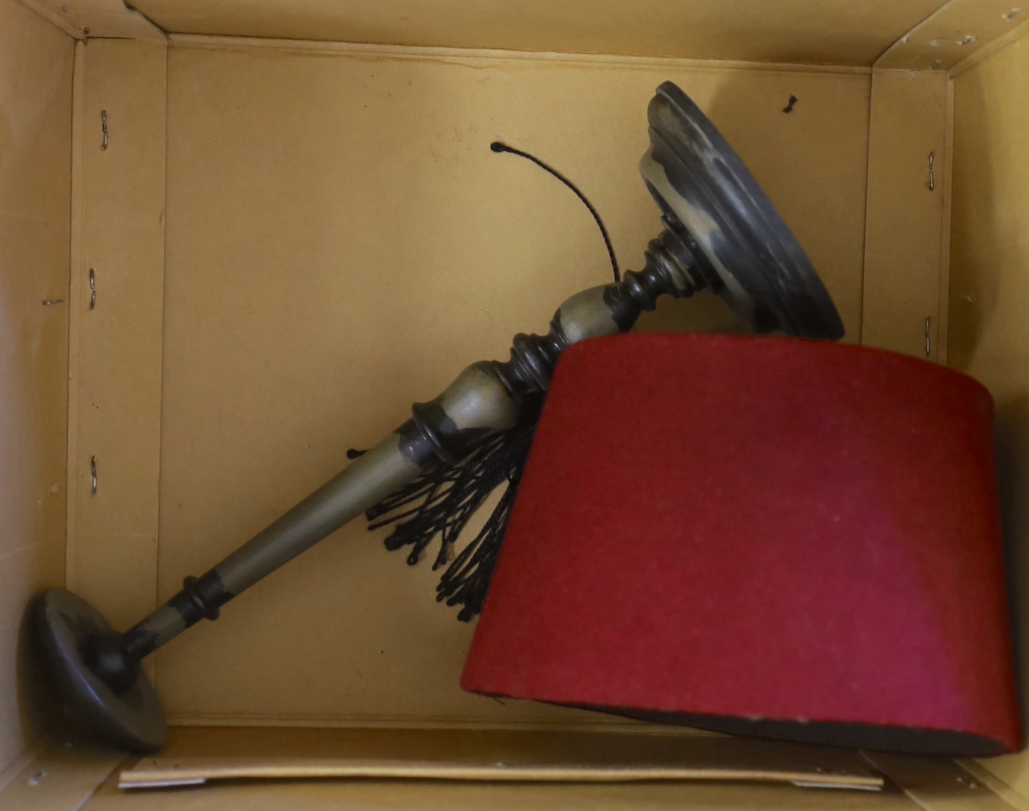 A Moroccan Fez and a Panama hat in a Dunn & Co hat box together with a hat stand